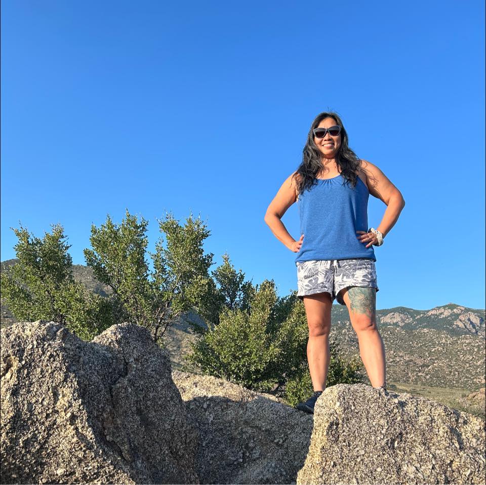 woman standing on rocks